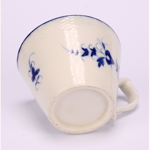 29 - A Caughley Chantilly Sprig pattern coffee cup, in underglaze blue, kick handle, 6cm high; a Caughley... 