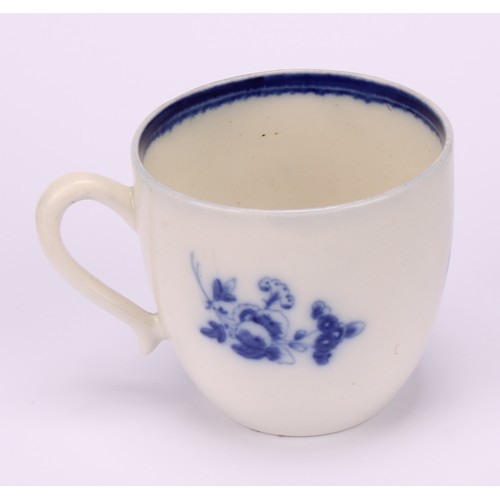 29 - A Caughley Chantilly Sprig pattern coffee cup, in underglaze blue, kick handle, 6cm high; a Caughley... 