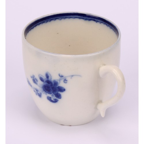 29 - A Caughley Chantilly Sprig pattern coffee cup, in underglaze blue, kick handle, 6cm high; a Caughley... 