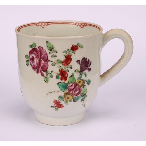 49 - A Liverpool coffee cup, decorated in polychrome with cabbage rose and scattered sprays, the interior... 