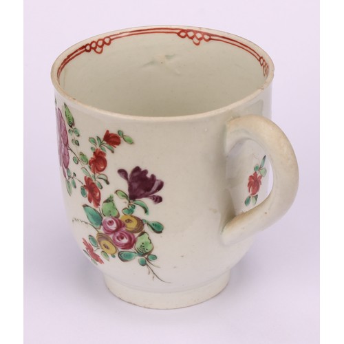 49 - A Liverpool coffee cup, decorated in polychrome with cabbage rose and scattered sprays, the interior... 