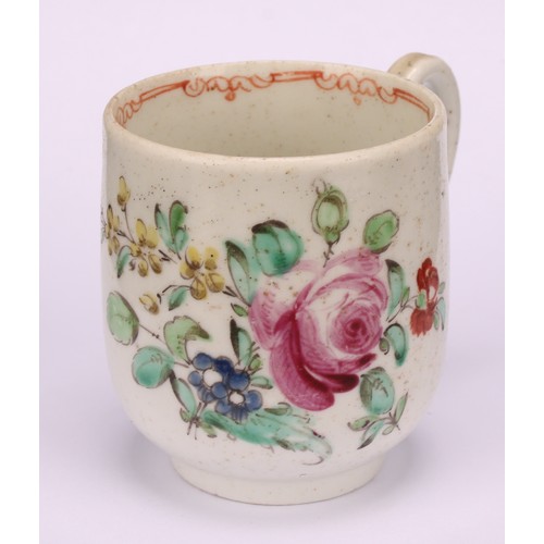 49 - A Liverpool coffee cup, decorated in polychrome with cabbage rose and scattered sprays, the interior... 