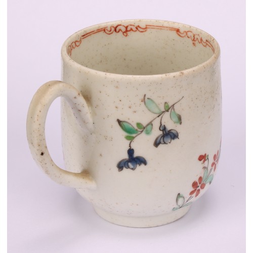 49 - A Liverpool coffee cup, decorated in polychrome with cabbage rose and scattered sprays, the interior... 