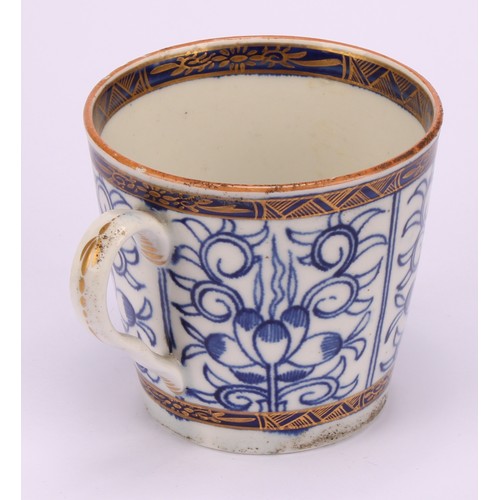 86 - A Worcester Royal Lily pattern cup and saucer, in underglaze blue, gilt highlighted borders, red lin... 