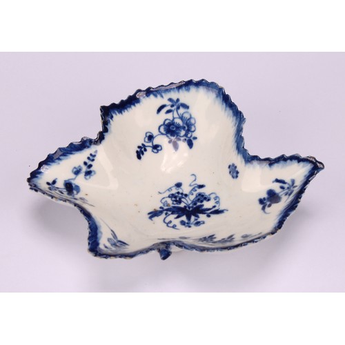 47 - A Bow leaf shaped pickle dish, decorated in underglaze blue with floral sprays, blue painted rim, 10... 