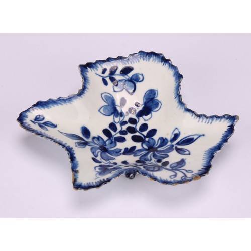 48 - A Bow leaf shaped pickle dish, decorated in underglaze blue with flowers and foliage, moulded exteri... 