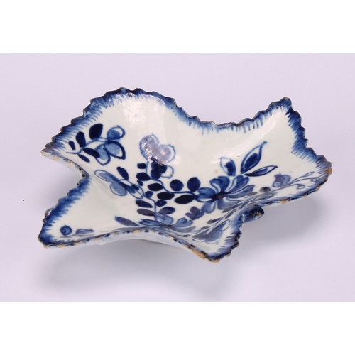 48 - A Bow leaf shaped pickle dish, decorated in underglaze blue with flowers and foliage, moulded exteri... 