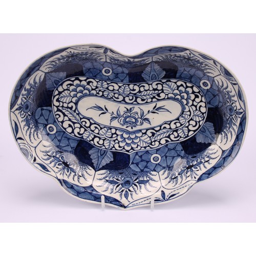 81 - A Worcester Kang Hsi Lotus pattern heart shaped dish, decorated in underglaze blue with flowers and ... 