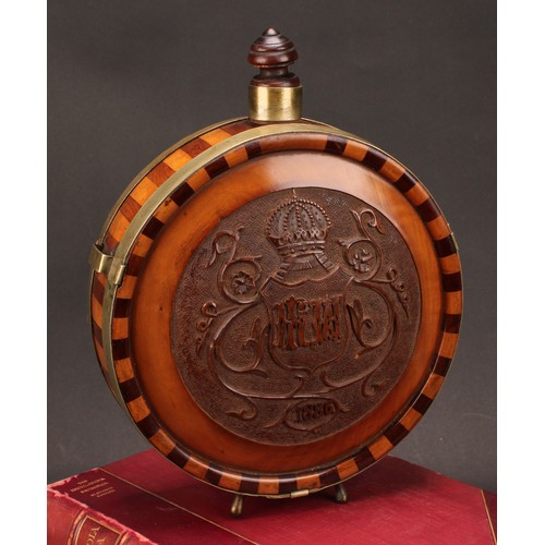 1184 - A 19th century Continental fruitwood circular flask, banded borders, carved in relief with a crowned... 