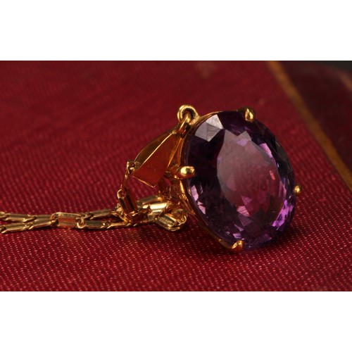 959 - An Amethyst pendant necklace, the oval amethyst approximately 17mm x 13mm, indistinctly marked yello... 