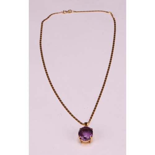 959 - An Amethyst pendant necklace, the oval amethyst approximately 17mm x 13mm, indistinctly marked yello... 