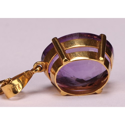 959 - An Amethyst pendant necklace, the oval amethyst approximately 17mm x 13mm, indistinctly marked yello... 