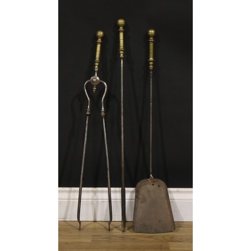 1283 - A set of Victorian brass and steel fire irons or fireside companions, the tongs 71cm long, c. 1890