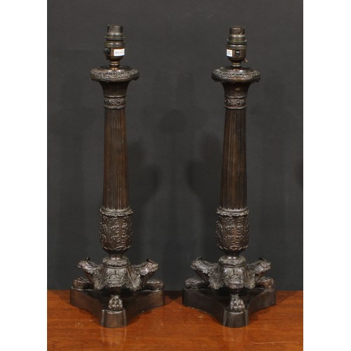 1248 - A pair of modern Empire style patinated bronze lamps, fluted columns terminating in a spreading acan... 