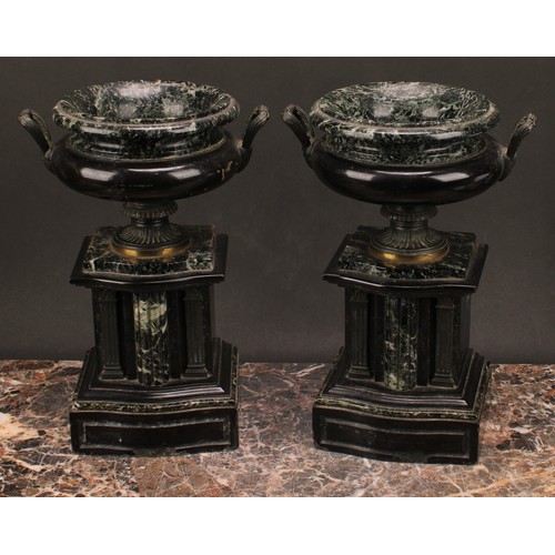 1288 - A pair of 19th century French brass footed verde antico and black marble urns, fluted handles, suppo... 