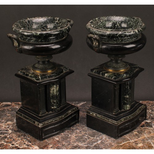 1288 - A pair of 19th century French brass footed verde antico and black marble urns, fluted handles, suppo... 