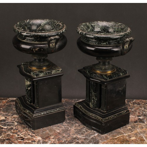 1288 - A pair of 19th century French brass footed verde antico and black marble urns, fluted handles, suppo... 