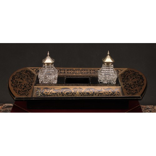 1921 - An Edwardian Boulle and ebonised brass marquetry inkstand, shaped rectangular body, the central well... 