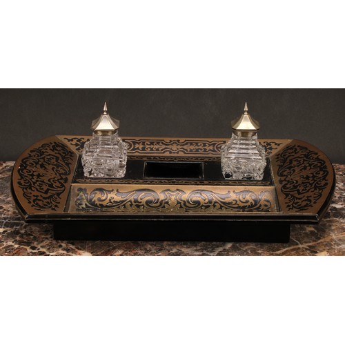 1921 - An Edwardian Boulle and ebonised brass marquetry inkstand, shaped rectangular body, the central well... 