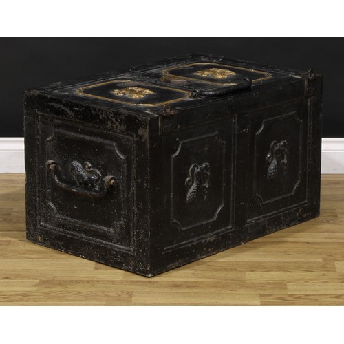 1321 - A 19th century cast iron strong box, the door and sides cast with lions, carry handles to sides, the... 