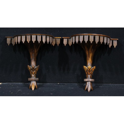 1292 - A pair of Adam design mahogany wall brackets, bowed plateaux above pendant friezes, 34.5cm wide, 20t... 