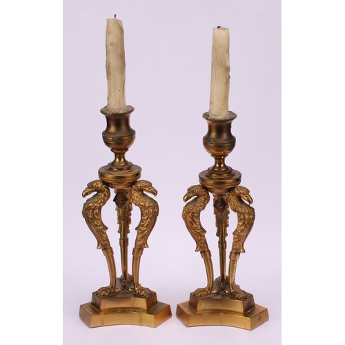 1290 - A pair of 19th century gilt bronze triform mantel candlesticks, campana sconces, griffin monopodia, ... 