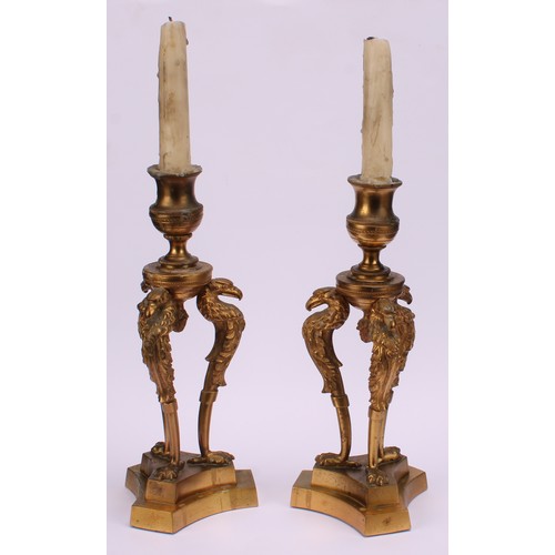 1290 - A pair of 19th century gilt bronze triform mantel candlesticks, campana sconces, griffin monopodia, ... 