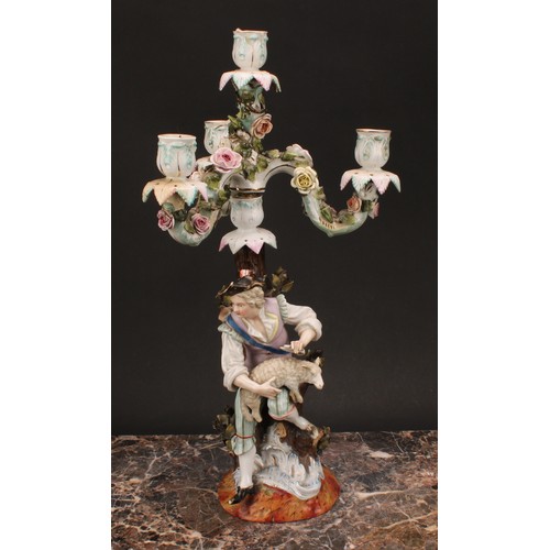 141 - A pair of 19th century German porcelain figural four-light, three-branch candelabra, as a shepherd a... 