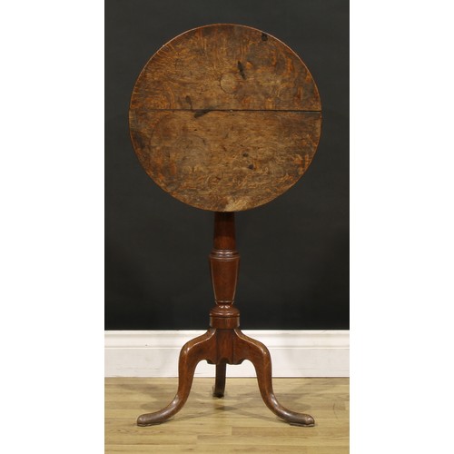 1403 - A George III oak tripod occasional table, circular tilting top, turned column, cabriole legs, pointe... 