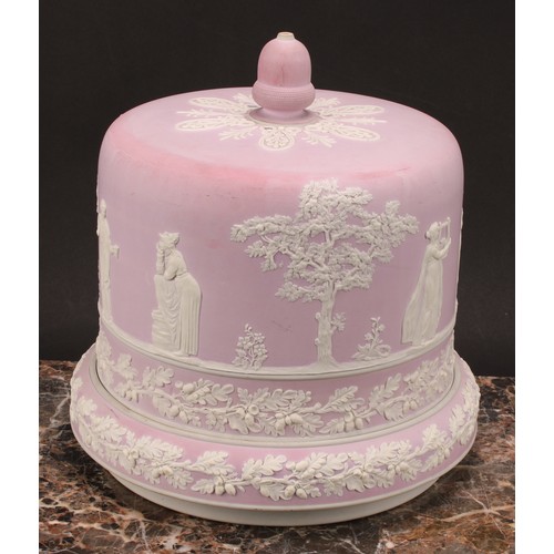 11 - A late Victorian lilac pink jasperware cheese dome, applied with Classical figures, trees and bands ... 