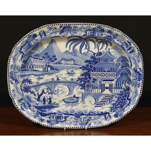 24 - A Victorian oval meat dish, transfer printed in tones of underglaze blue in the Chinese taste with w... 