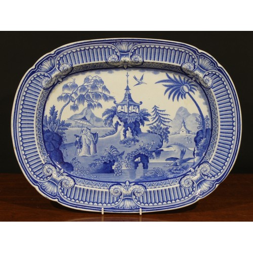 24 - A Victorian oval meat dish, transfer printed in tones of underglaze blue in the Chinese taste with w... 