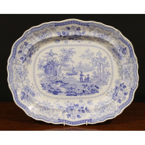 24 - A Victorian oval meat dish, transfer printed in tones of underglaze blue in the Chinese taste with w... 