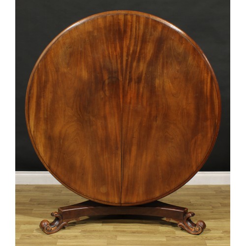 1352 - A Victorian mahogany centre table, circular tilting top with moulded edge, panelled baluster column,... 