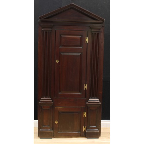 1389 - A 19th century mahogany architectural corner cabinet, pointed-arch pediment above two raised and fie... 