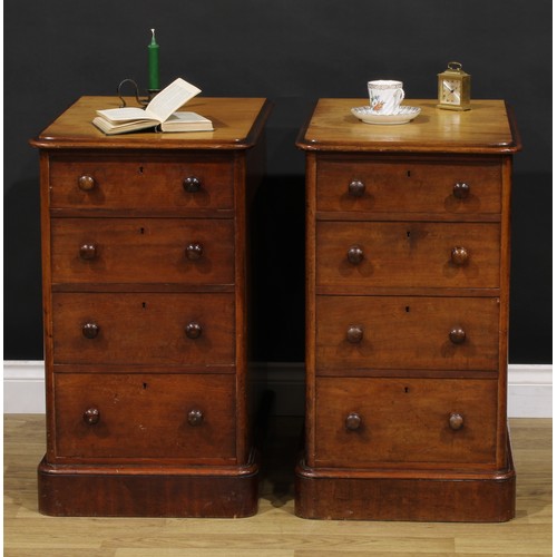 1341 - A pair of Victorian mahogany bedroom chests, each of four graduated drawers, probably formerly the p... 