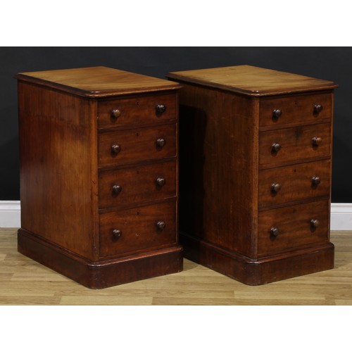 1341 - A pair of Victorian mahogany bedroom chests, each of four graduated drawers, probably formerly the p... 