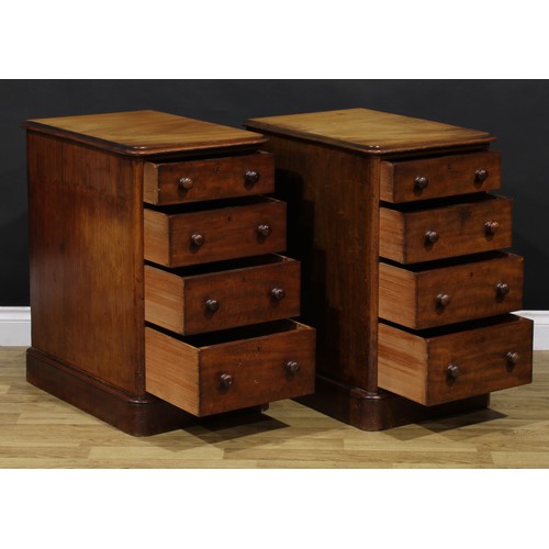 1341 - A pair of Victorian mahogany bedroom chests, each of four graduated drawers, probably formerly the p... 