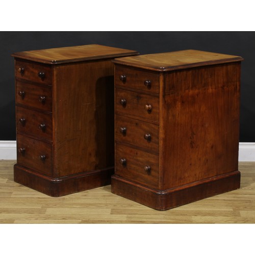 1341 - A pair of Victorian mahogany bedroom chests, each of four graduated drawers, probably formerly the p... 