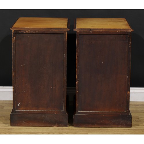 1341 - A pair of Victorian mahogany bedroom chests, each of four graduated drawers, probably formerly the p... 