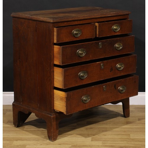 1190 - A George III oak chest, of two short and three long graduated drawers, brass swing handles, skirted ... 