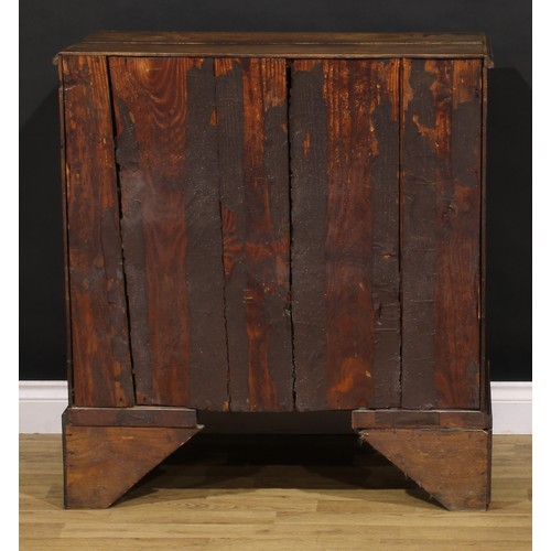 1190 - A George III oak chest, of two short and three long graduated drawers, brass swing handles, skirted ... 