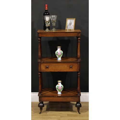 1877 - A William IV rosewood three-tier whatnot, rounded rectangular plateaux, turned supports, drawer to c... 