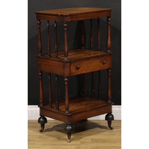 1877 - A William IV rosewood three-tier whatnot, rounded rectangular plateaux, turned supports, drawer to c... 