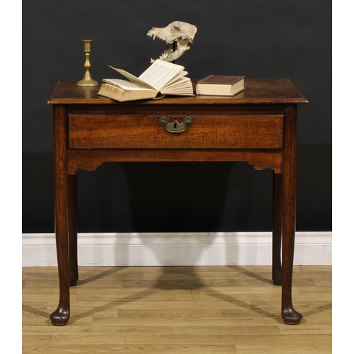 1236 - A George II oak side table, rectangular top with moulded edge above a long frieze drawer, brass swin... 