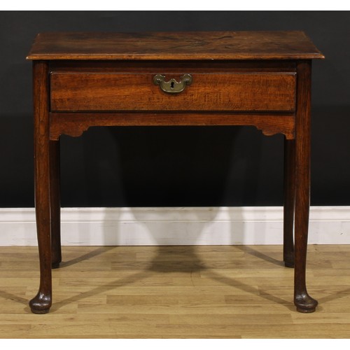 1236 - A George II oak side table, rectangular top with moulded edge above a long frieze drawer, brass swin... 