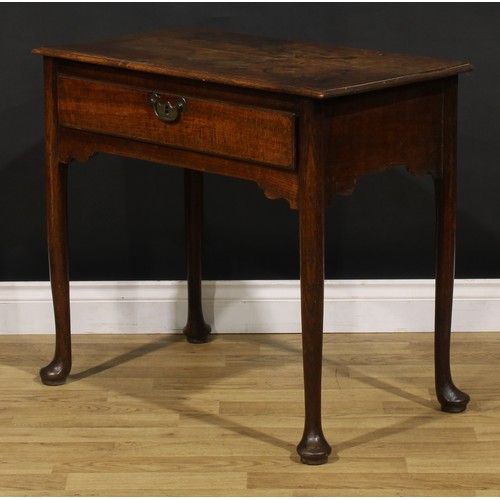 1236 - A George II oak side table, rectangular top with moulded edge above a long frieze drawer, brass swin... 