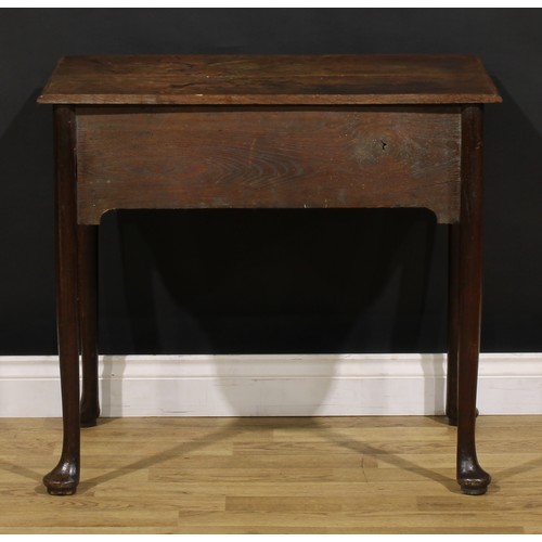 1236 - A George II oak side table, rectangular top with moulded edge above a long frieze drawer, brass swin... 