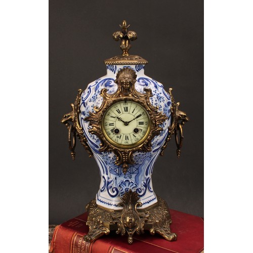 1558 - A late 19th/early 20th century French brass mounted Delftware mantel clock, 8.5cm circular dial insc... 