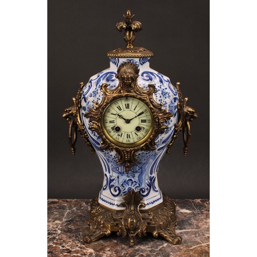 1558 - A late 19th/early 20th century French brass mounted Delftware mantel clock, 8.5cm circular dial insc... 